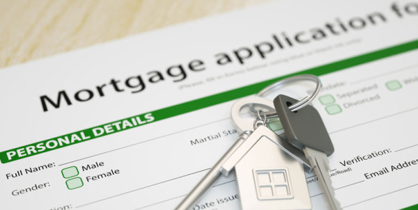 mortgage-application-house-keys Blank mortgage application with house keys on top